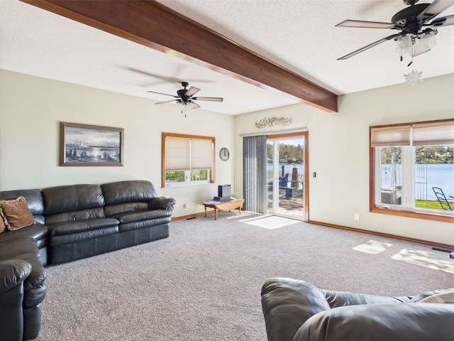 480 Peninsula Dr, Columbiaville, MI 48421 - living room featuring ceiling fan, baseboards, carpet, beamed ceiling, and a textured ceiling