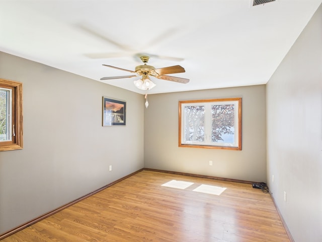 480 Peninsula Dr, Columbiaville, MI 48421 - unfurnished room featuring ceiling fan, light wood finished floors, and baseboards
