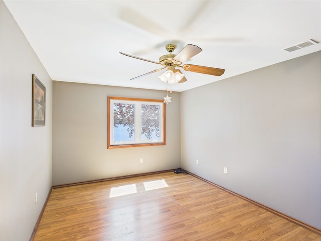 480 Peninsula Dr, Columbiaville, MI 48421 - empty room with ceiling fan, light wood-style flooring, and baseboards