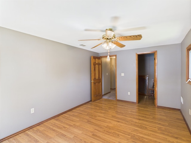 480 Peninsula Dr, Columbiaville, MI 48421 - unfurnished bedroom featuring light wood finished floors, baseboards, and a ceiling fan