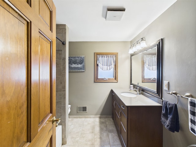 480 Peninsula Dr, Columbiaville, MI 48421 - full bathroom with tile patterned floors, vanity, baseboards, and a shower