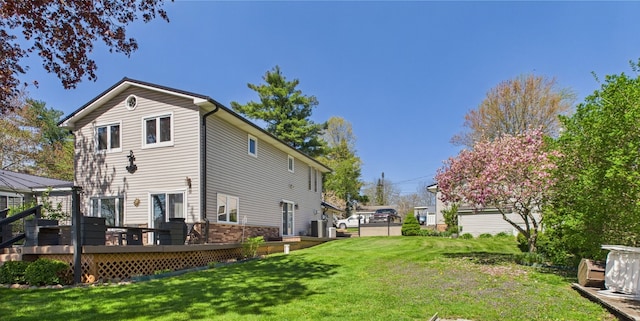 480 Peninsula Dr, Columbiaville, MI 48421 - back of house featuring a yard and a wooden deck