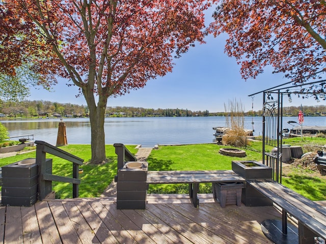 480 Peninsula Dr, Columbiaville, MI 48421 - deck with a water view and a yard