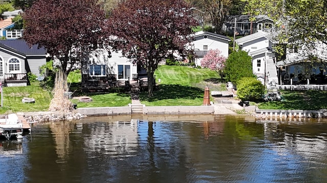 480 Peninsula Dr, Columbiaville, MI 48421 - surrounding community with a water view, a yard, a boat dock, and a residential view