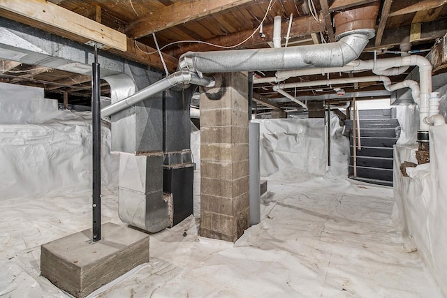 unfinished below grade area featuring heating unit