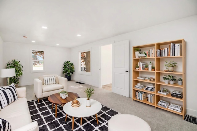 carpeted living room featuring recessed lighting