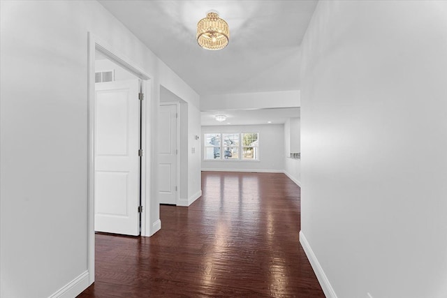 1132 Superior Blvd, Wyandotte, MI 48192 - hallway with wood finished floors, baseboards, and a chandelier