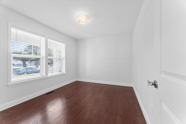 1132 Superior Blvd, Wyandotte, MI 48192 - spare room featuring dark wood finished floors and baseboards