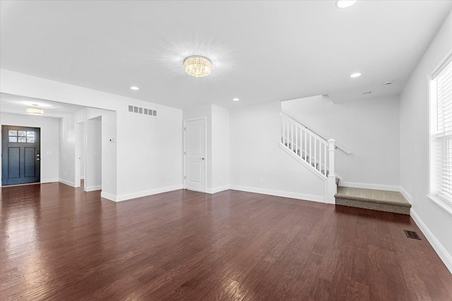 1132 Superior Blvd, Wyandotte, MI 48192 - unfurnished living room with stairs, dark wood-style floors, baseboards, recessed lighting, and a chandelier