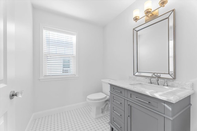 1132 Superior Blvd, Wyandotte, MI 48192 - bathroom with toilet, vanity, baseboards, and tile patterned floors