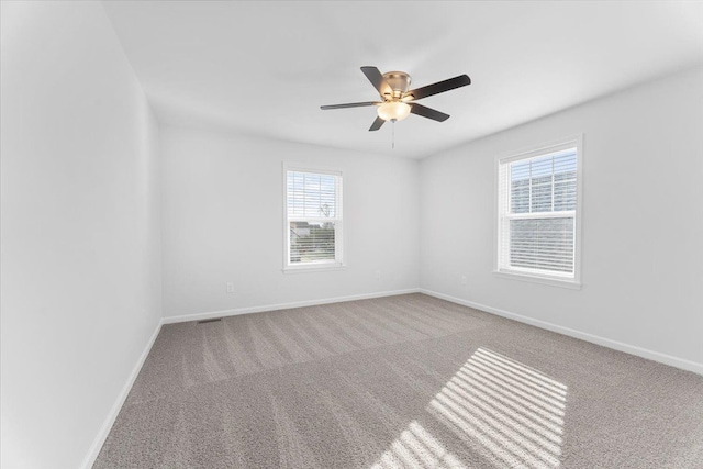 1132 Superior Blvd, Wyandotte, MI 48192 - spare room featuring carpet flooring, a ceiling fan, and baseboards