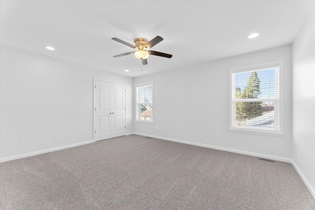 1132 Superior Blvd, Wyandotte, MI 48192 - spare room featuring healthy amount of natural light, a ceiling fan, baseboards, carpet, and recessed lighting