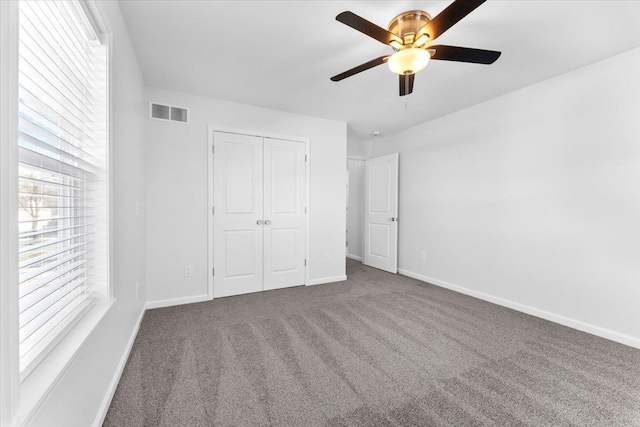 1132 Superior Blvd, Wyandotte, MI 48192 - unfurnished bedroom with carpet, baseboards, a closet, and ceiling fan