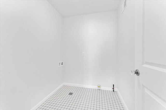 1132 Superior Blvd, Wyandotte, MI 48192 - laundry area with washer hookup, baseboards, and tile patterned floors