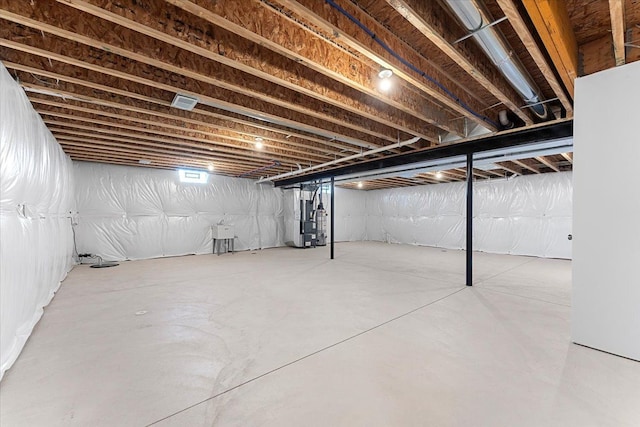 1132 Superior Blvd, Wyandotte, MI 48192 - unfinished below grade area featuring heating unit and a sink