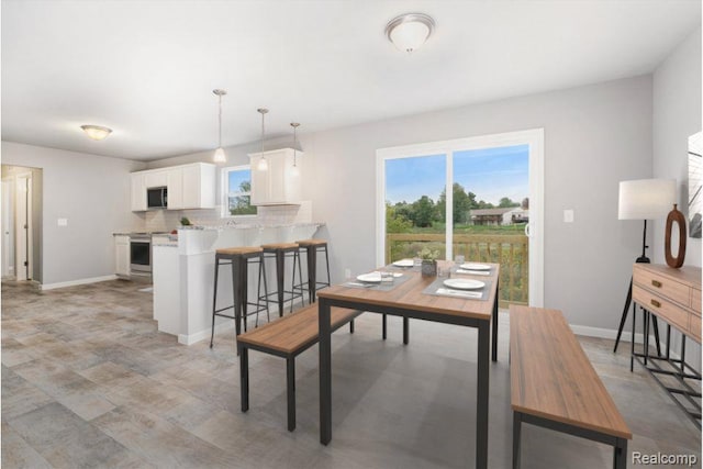 735 Lone Oak Way, Tecumseh, MI 49286 - dining space featuring plenty of natural light