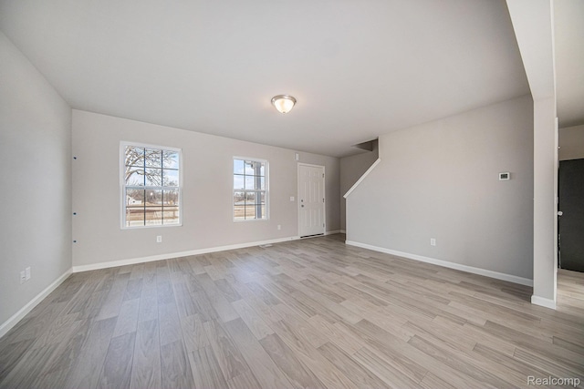 735 Lone Oak Way, Tecumseh, MI 49286 - unfurnished living room featuring light wood-style flooring