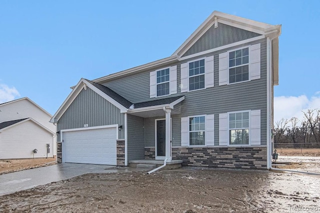 735 Lone Oak Way, Tecumseh, MI 49286 - view of front facade featuring stone siding, concrete driveway, and a garage