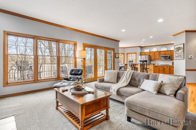 7620 Spring Point Ct NE, Rockford, MI 49341 - living area with recessed lighting, baseboards, ornamental molding, and light carpet