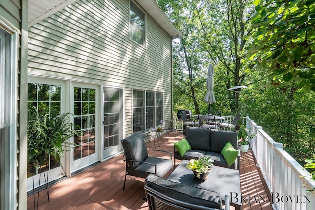 7620 Spring Point Ct NE, Rockford, MI 49341 - wooden deck with an outdoor hangout area and outdoor dining space