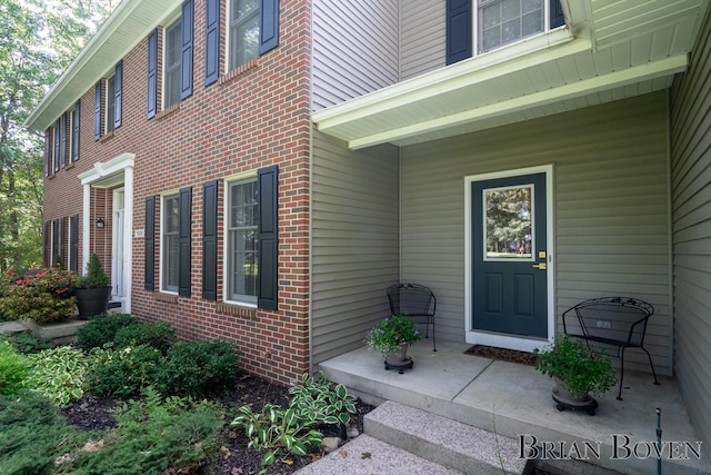 7620 Spring Point Ct NE, Rockford, MI 49341 - entrance to property featuring brick siding and a porch