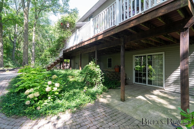 7620 Spring Point Ct NE, Rockford, MI 49341 - view of patio featuring stairway and a wooden deck