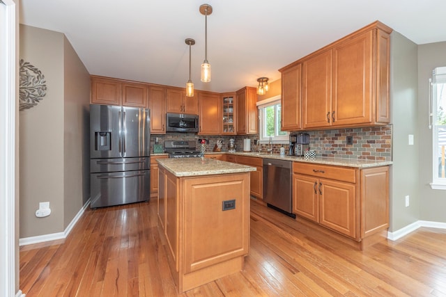 661 Morning Glory Ln, Milan, MI 48160 - kitchen with stainless steel appliances, a sink, light wood-type flooring, and baseboards
