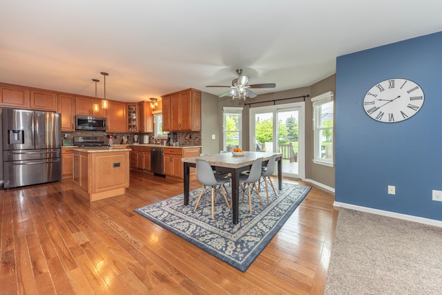 661 Morning Glory Ln, Milan, MI 48160 - dining space featuring baseboards, light wood-style flooring, and ceiling fan