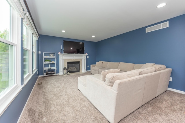 661 Morning Glory Ln, Milan, MI 48160 - living room with carpet flooring, baseboards, a fireplace with flush hearth, and recessed lighting