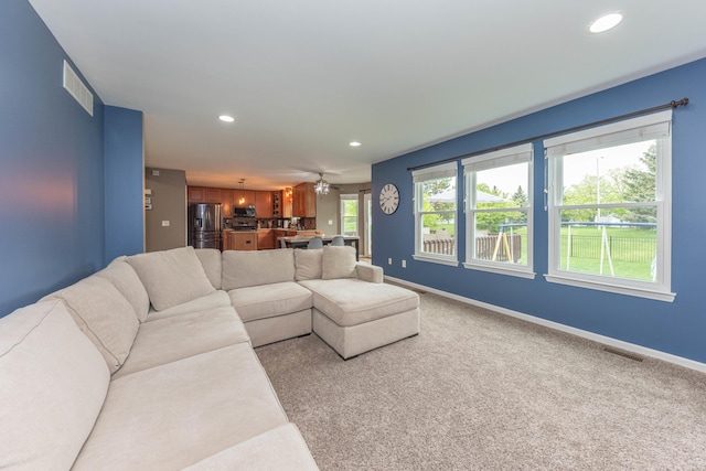 661 Morning Glory Ln, Milan, MI 48160 - living room featuring recessed lighting, baseboards, and light carpet