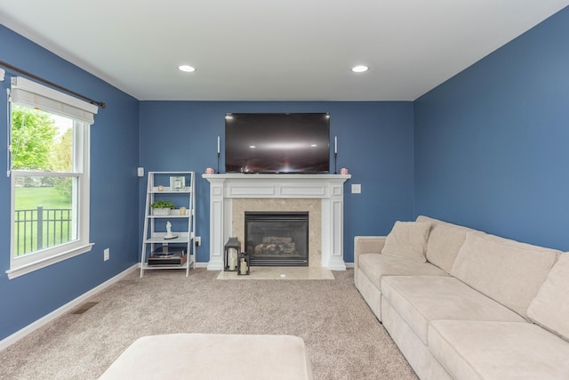661 Morning Glory Ln, Milan, MI 48160 - carpeted living area with baseboards, a premium fireplace, and recessed lighting