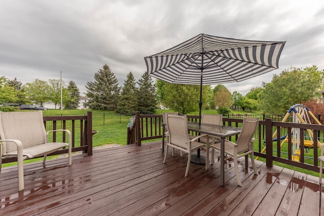 661 Morning Glory Ln, Milan, MI 48160 - deck featuring outdoor dining space and a playground