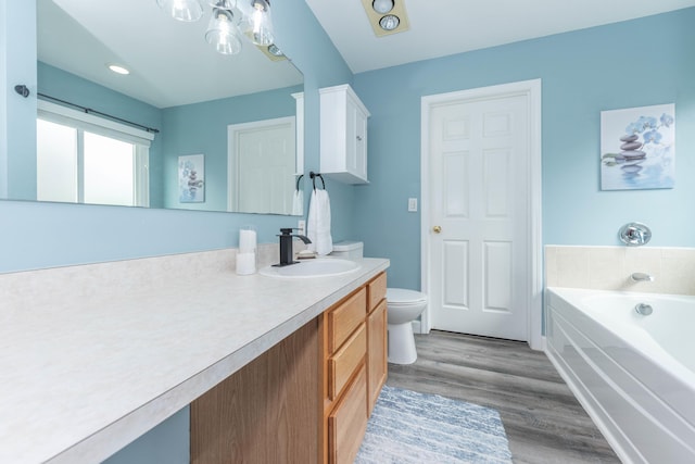 661 Morning Glory Ln, Milan, MI 48160 - bathroom with vanity, a garden tub, wood finished floors, toilet, and a chandelier