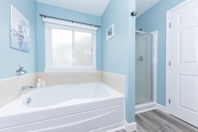 661 Morning Glory Ln, Milan, MI 48160 - full bathroom with a stall shower, a garden tub, and wood finished floors