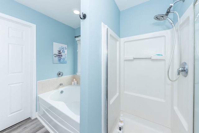 661 Morning Glory Ln, Milan, MI 48160 - full bath with a shower stall, wood finished floors, and a garden tub