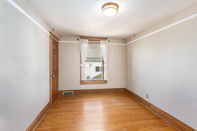 721 W Washington St, Ann Arbor, MI 48103 - empty room with light wood-type flooring and baseboards