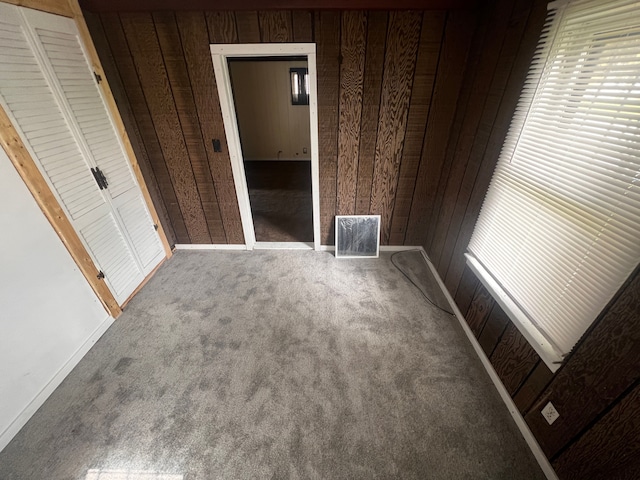 12791 Coleen Ave, Warren, MI 48089 - unfurnished bedroom with wooden walls, carpet flooring, and baseboards