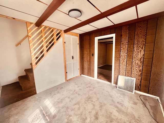12791 Coleen Ave, Warren, MI 48089 - unfurnished living room with wooden walls, stairway, and carpet floors