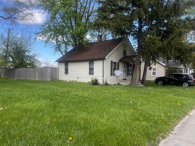 12791 Coleen Ave, Warren, MI 48089 - view of side of property with a chimney and roof with shingles