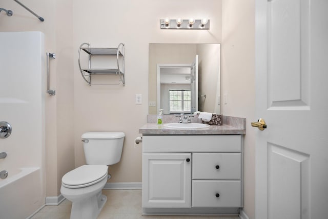 full bathroom featuring toilet, vanity, washtub / shower combination, and baseboards