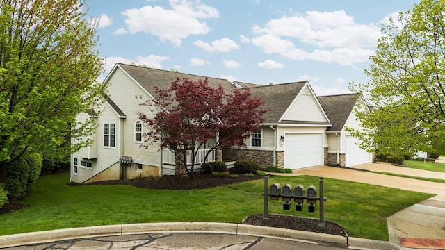 view of property hidden behind natural elements featuring a front yard, concrete driveway, a garage, and a shingled roof