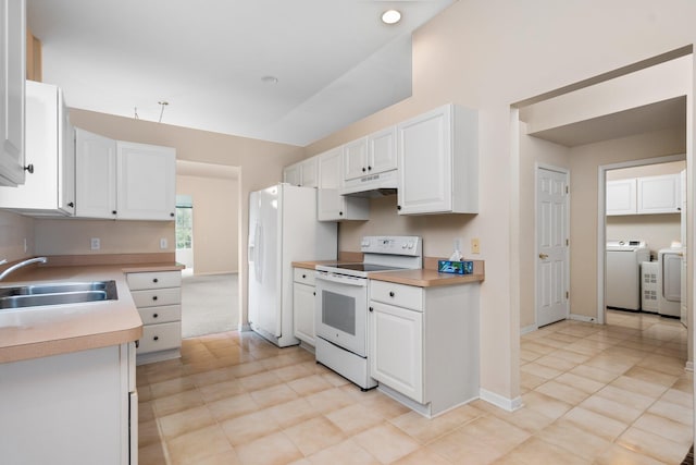 kitchen with white appliances, a sink, washer and dryer, under cabinet range hood, and white cabinetry