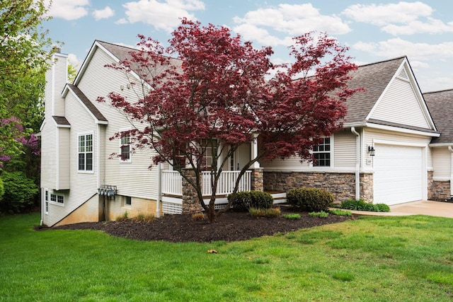 view of front of home with a front lawn, concrete driveway, a chimney, and a garage