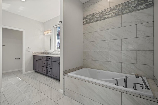 12150 Shaffer Rd, Davisburg, MI 48350 - bathroom featuring a garden tub, vanity, and baseboards
