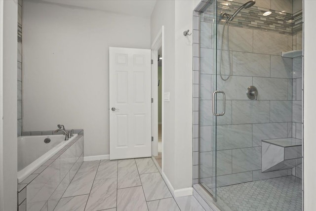 12150 Shaffer Rd, Davisburg, MI 48350 - bathroom with a stall shower, a garden tub, baseboards, and marble look tile flooring