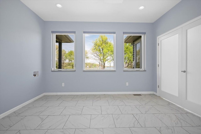 12150 Shaffer Rd, Davisburg, MI 48350 - empty room featuring baseboards, recessed lighting, and light marble finish floors
