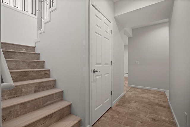 12150 Shaffer Rd, Davisburg, MI 48350 - stairs with wood finished floors and baseboards