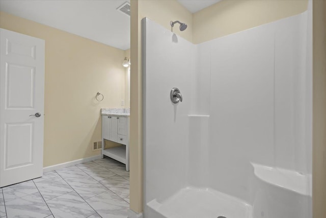 12150 Shaffer Rd, Davisburg, MI 48350 - full bathroom featuring marble finish floors, a shower, vanity, and baseboards
