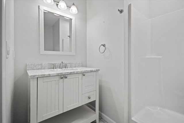 12150 Shaffer Rd, Davisburg, MI 48350 - full bath featuring vanity, baseboards, and a shower