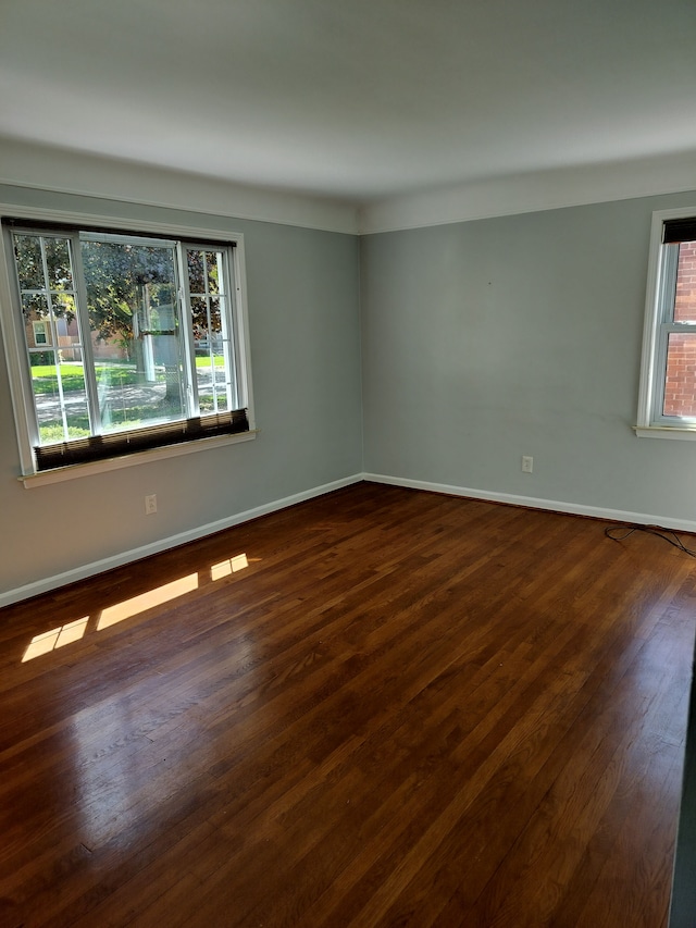 9909 Brookfield St, Livonia, MI 48150 - empty room featuring baseboards and dark wood finished floors